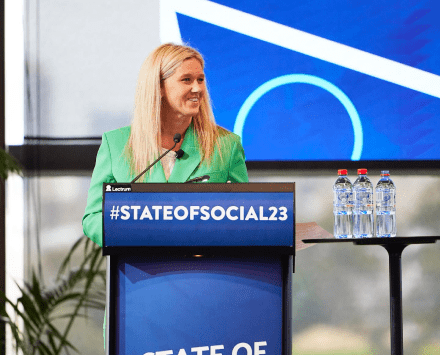 Meg Coffey speaking on stage