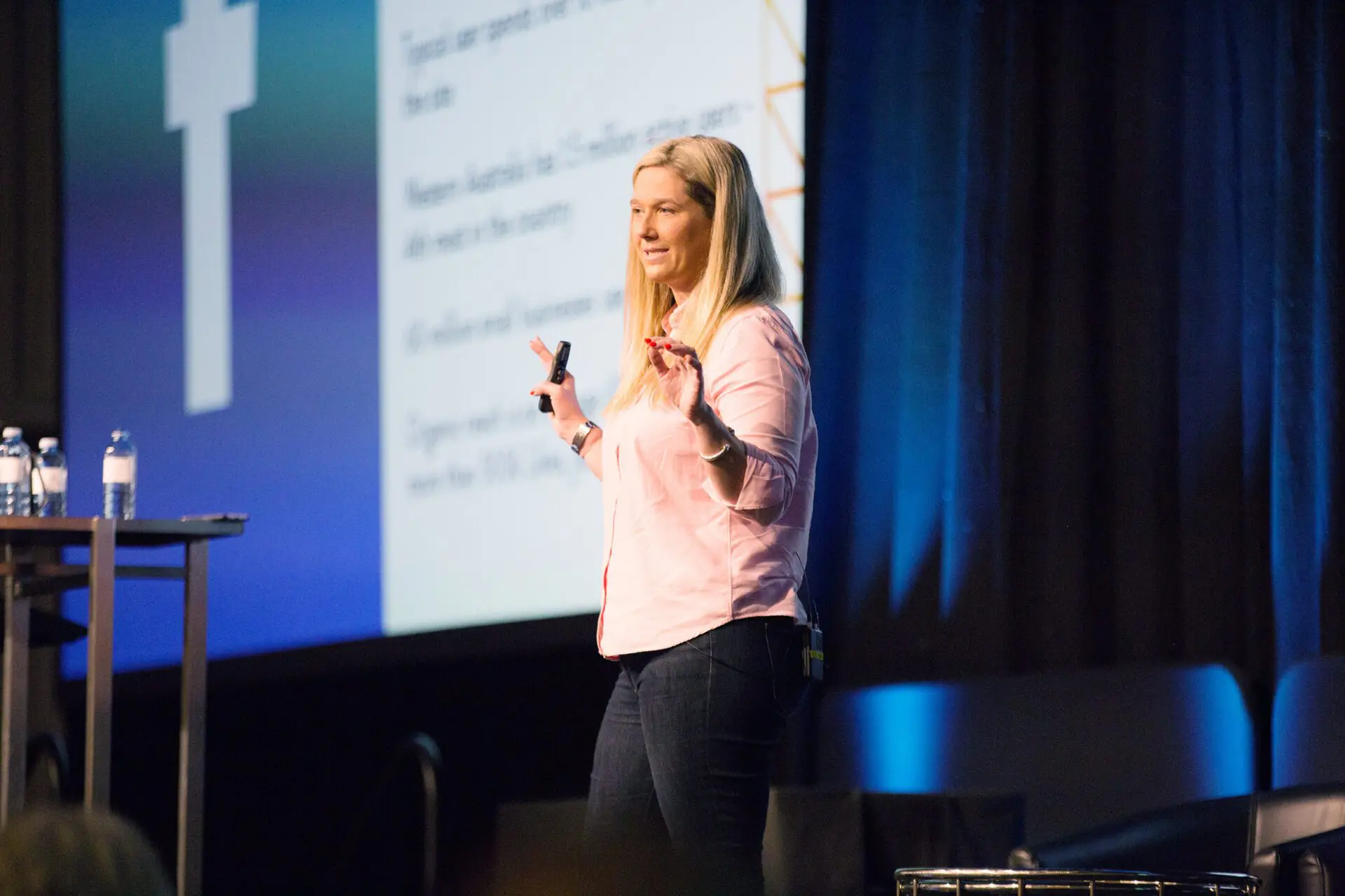 Meg Coffey presenting on stage