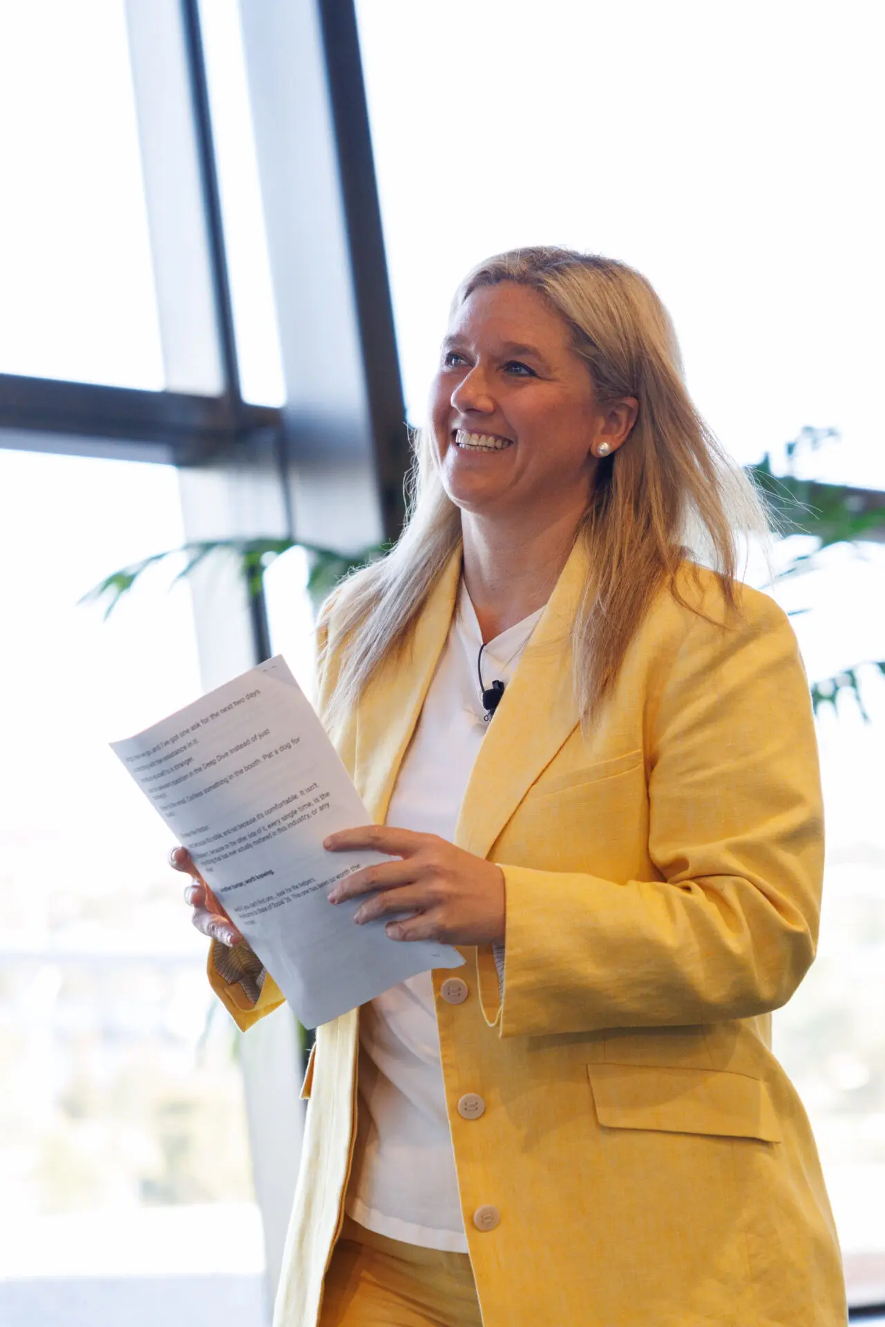 Meg Coffey presenting, notes in hand