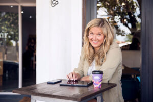 MEG COFFEY SMILES AT TOURISM CONFERENCE